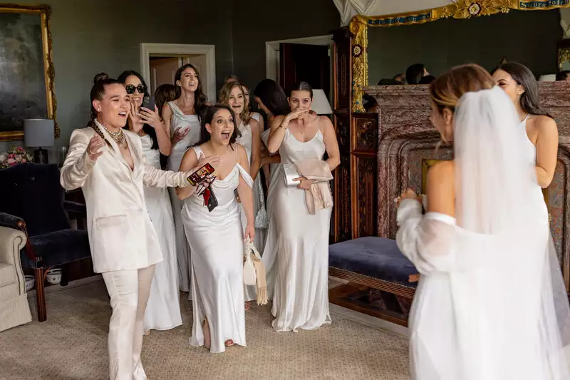 First look with bridesmaids in the bridal suite of Adare Manor, Ireland