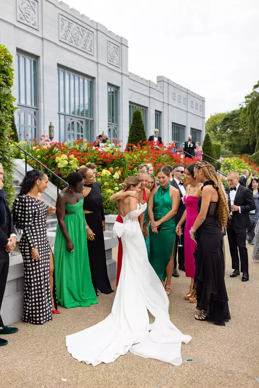 Olivia Amato celebrates with Peloton colleagues at her wedding celebration at wedding venue Adare Manor