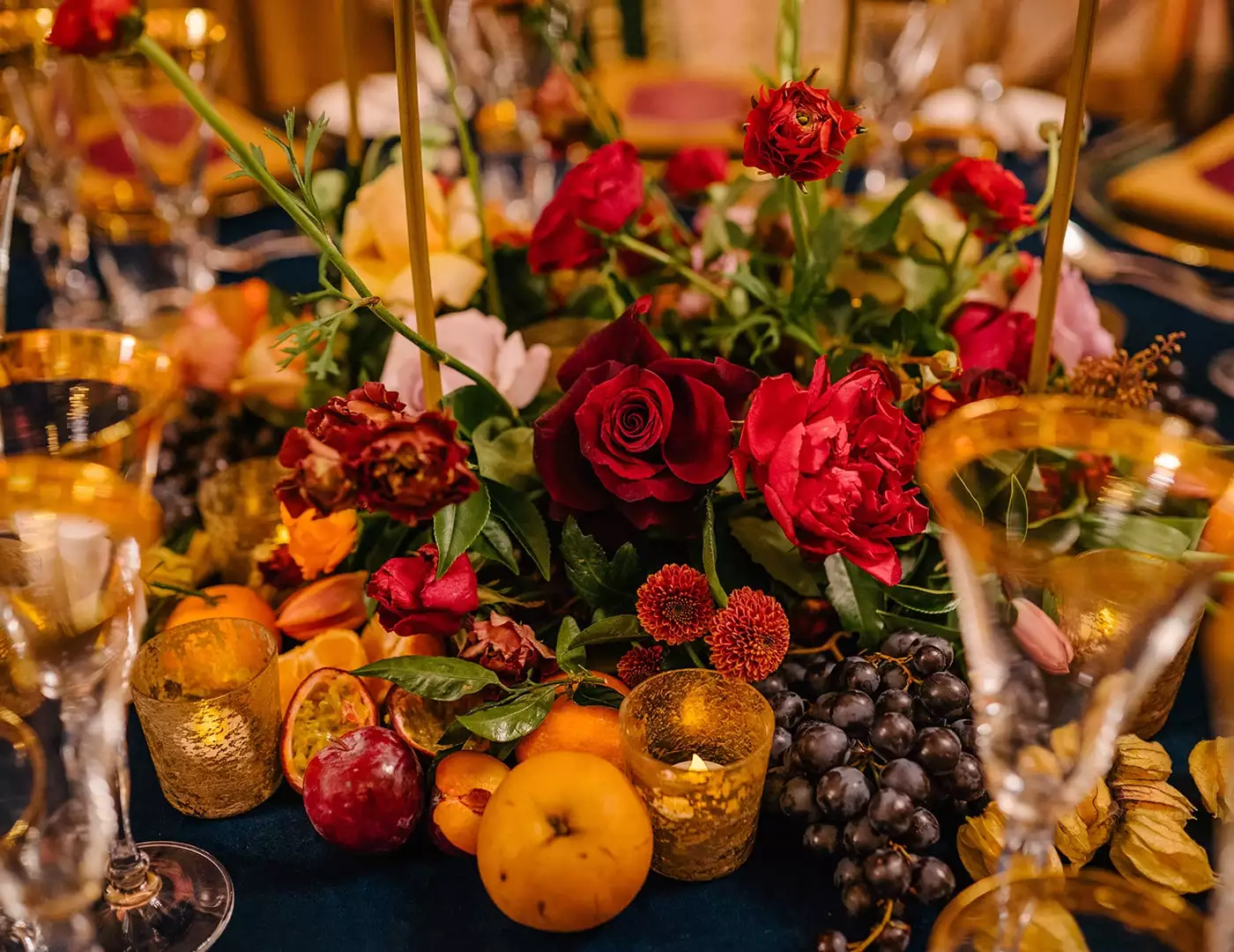 Private celebration at home — seasonal Thanksgiving tablescape with autumn florals, fruit and a layered table setting.