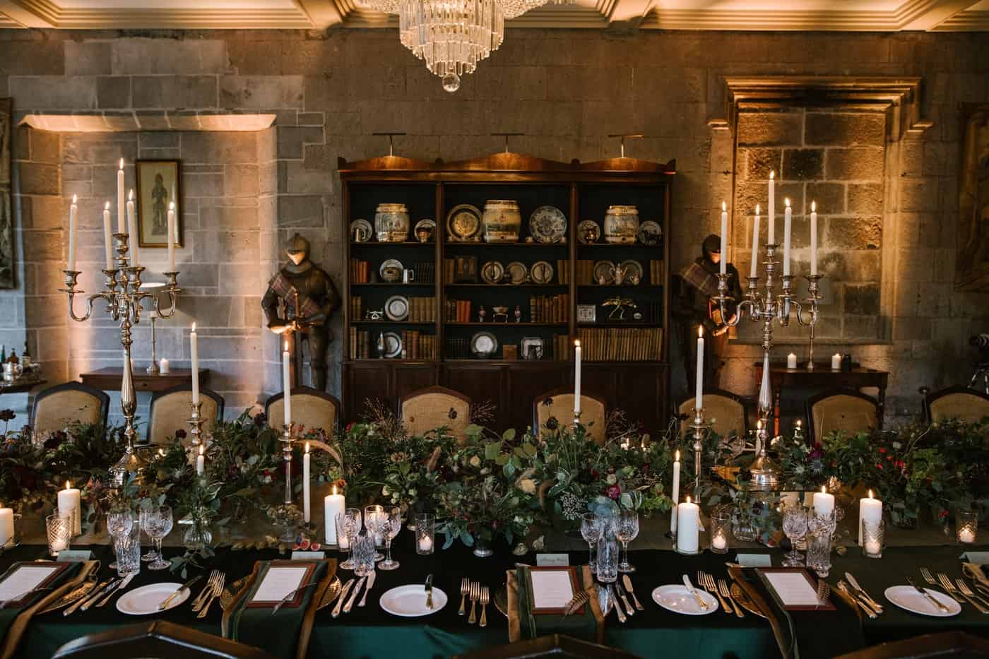 Corporate events Ireland — candlelit dining table with greenery styling and formal table setting for an event celebration.