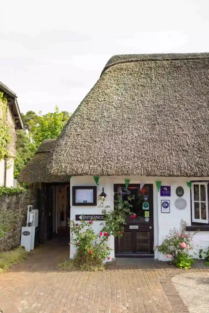 Destination wedding in Ireland at Adare Manor, County Limerick — thatched cottage in Adare village used as a rehearsal dinner location.