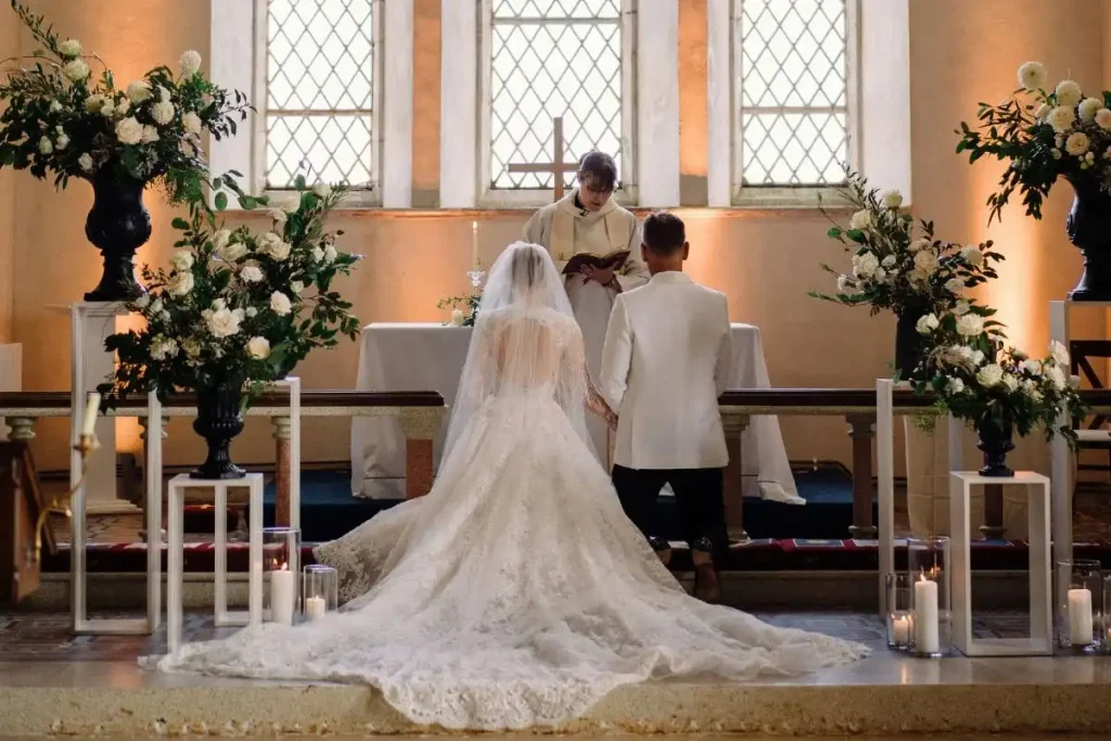 Destination wedding ceremony at Ballynahinch Castle, County Galway — bride and groom during a religious ceremony as part of a wedding celebration in Connemara.