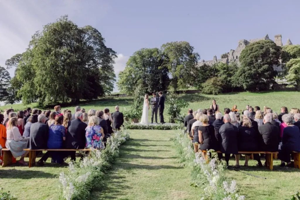 Irish destination wedding at Cashel Palace, County Tipperary — outdoor wedding ceremony at the foothills of the Rock of Cashel.