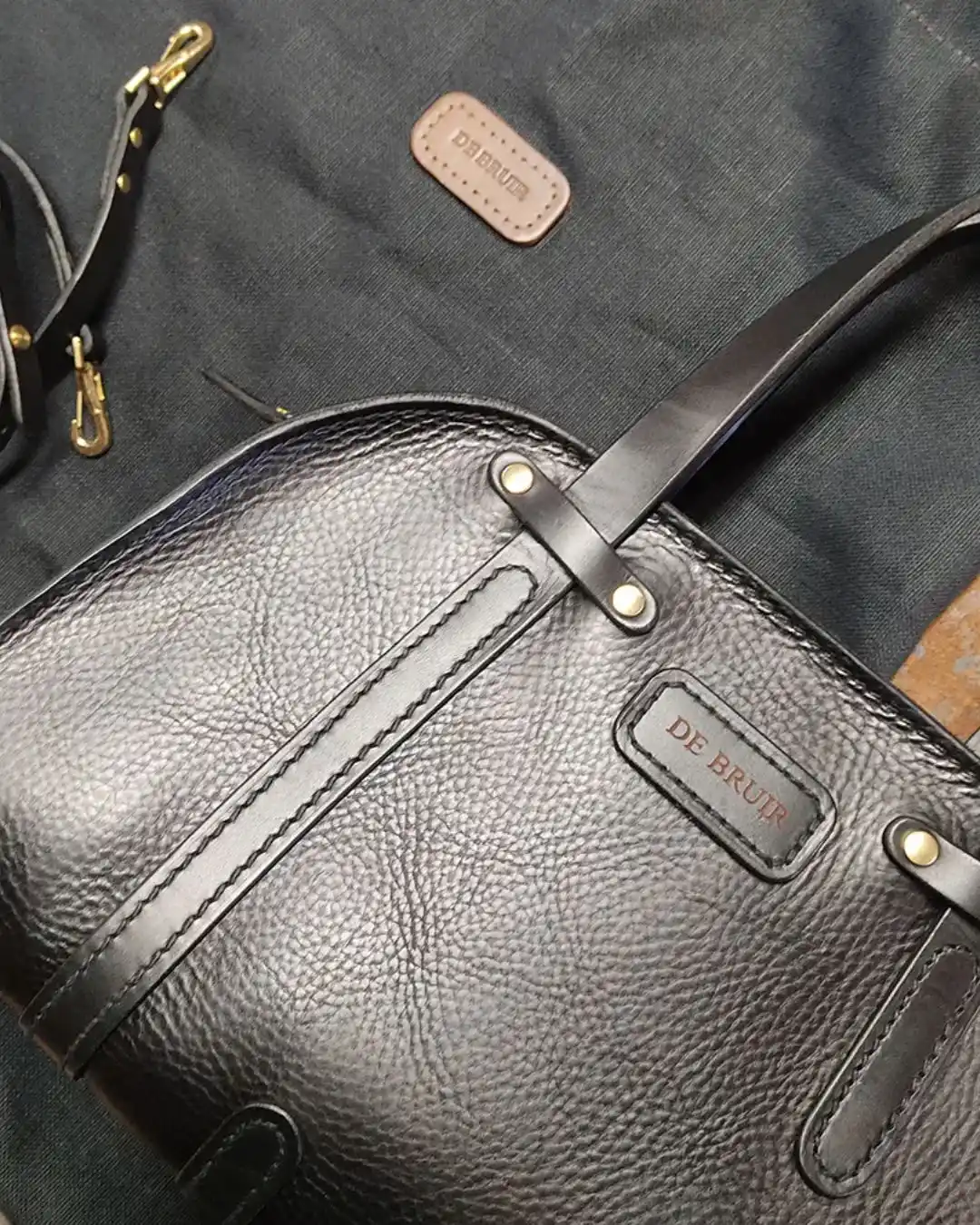 Irish artisan craftsmanship — handmade DE BRUIR leather bag created for luxury travel and destination wedding weekends in Ireland.