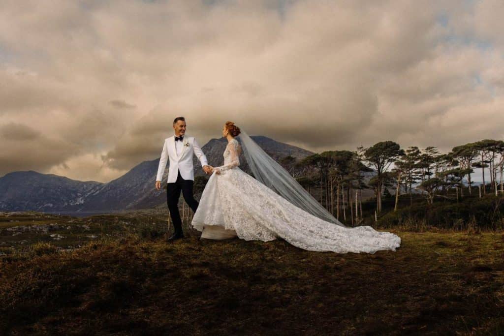 Destination wedding in Ireland at Ballynahinch Castle, County Galway — bride and groom portraits on the Connemara moorlands during an outdoor celebration.