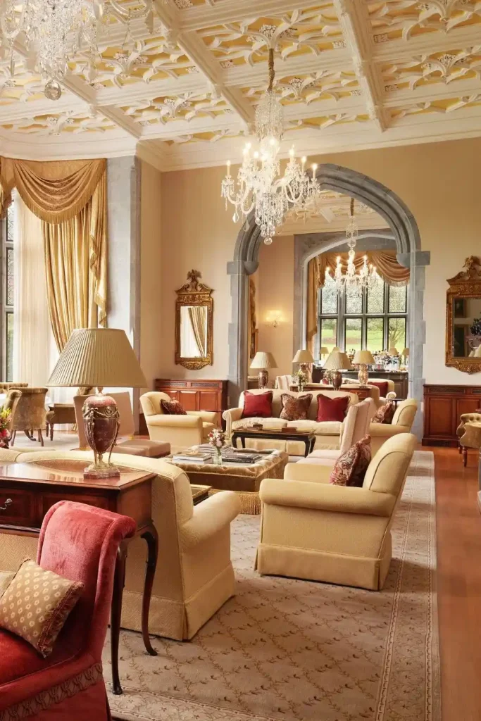Irish castle wedding at Adare Manor, County Limerick — bright drawing room interior featuring soft lounge seating, refined upholstery, and tall windows filling the space with natural light across the historic castle setting.