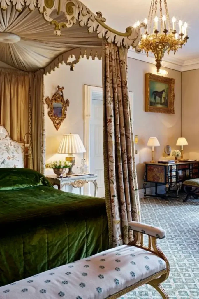 Irish castle wedding at Ashford Castle — Reagan Presidential Suite with antique George III four-poster bed, Murano chandelier, original fireplace, and floor-to-ceiling views of Lough Corrib.