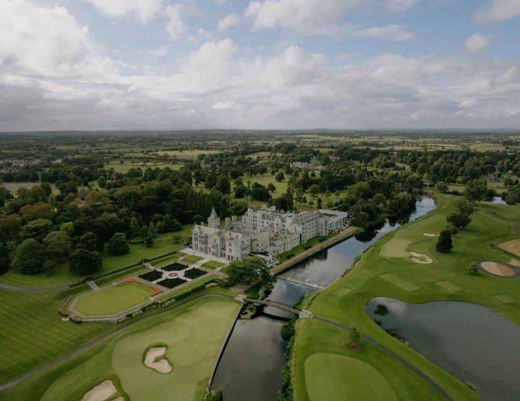 Country estate wedding in Ireland at Adare Manor — aerial view of the estate and surrounding countryside during a destination wedding celebration.