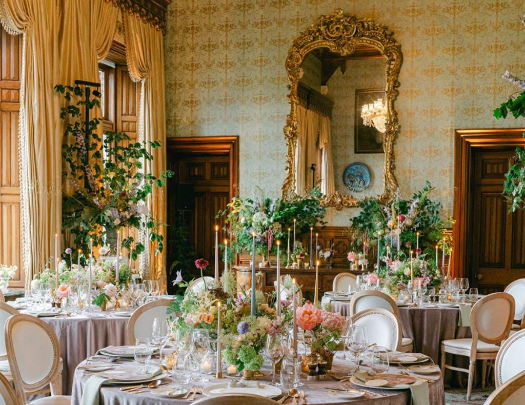 Intimate wedding in Ireland at Ashford Castle, County Mayo — private dinner in the Connaught Room with floral tablescape and candlelit reception design.