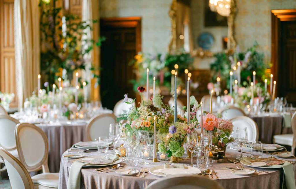 Irish destination wedding at Ashford Castle, County Mayo — colourful floral tablescape with layered dining details for an intimate wedding celebration.