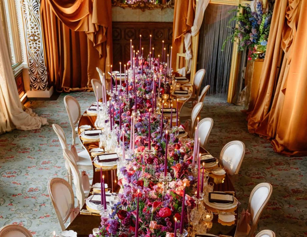 Private celebration at Ashford Castle, County Mayo — dining table design with abundant floral installations in the Connaught Room.