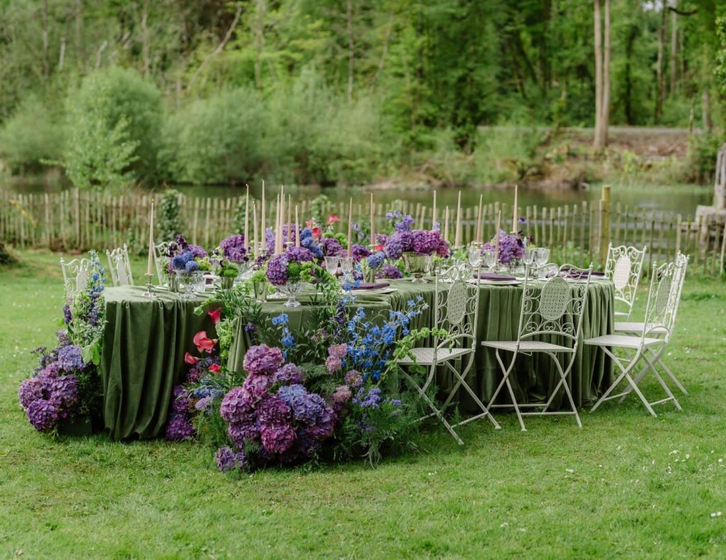 Private party planner Ireland in Cong, County Mayo — riverside outdoor dining beside the Cong River during a private celebration.
